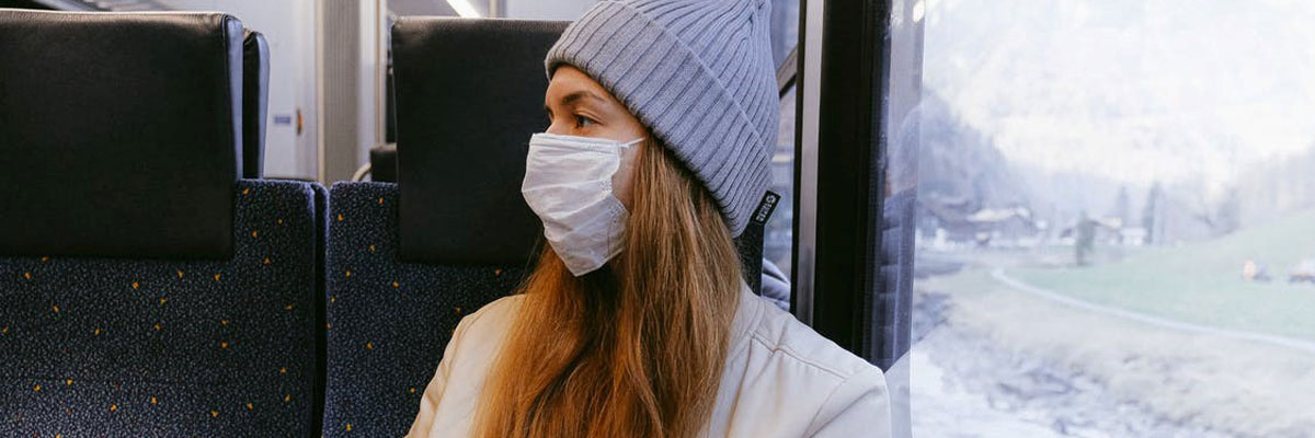 Girl on train with mask